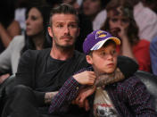 LOS ANGELES, CA - APRIL 29: David Beckham and son Brooklyn take in Game One of the Western Conference Quarterfinals between the Los Angeles Lakers and the Denver Nuggets in the 2012 NBA Playoffs on April 29, 2012 at Staples Center in Los Angeles, California. The Lakers defeated the Nuggets 103-88. NOTE TO USER: User expressly acknowledges and agrees that, by downloading and or using this photograph, User is consenting to the terms and conditions of the Getty Images License Agreement. (Photo by Jeff Gross/Getty Images)