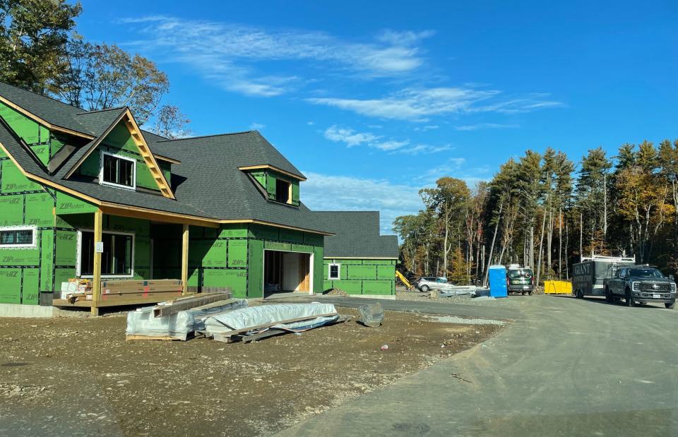 A long drive leading to Woodstone at York Village leads to some homes finished and some still being developed.