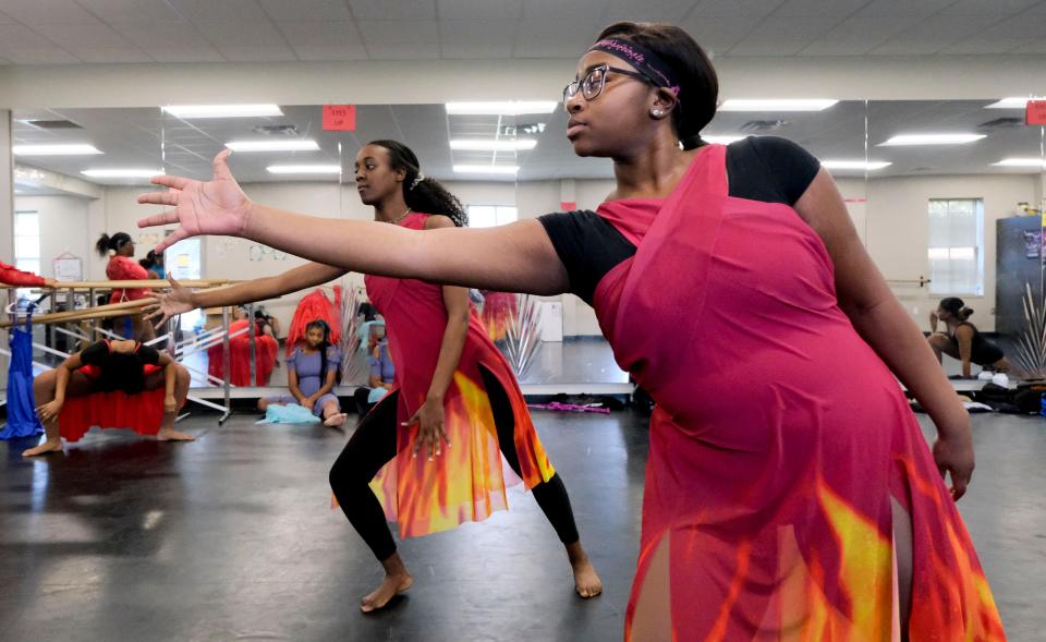 Students in the Tuscaloosa Fine Arts Academy at Paul W. Bryant High School on Monday rehearse for their roles in the Tuscaloosa Symphony Orchestra's annual young people's concert "Give Me Space." Diaya Tubbs, and Shakily Bonner rehearse a part of their dance