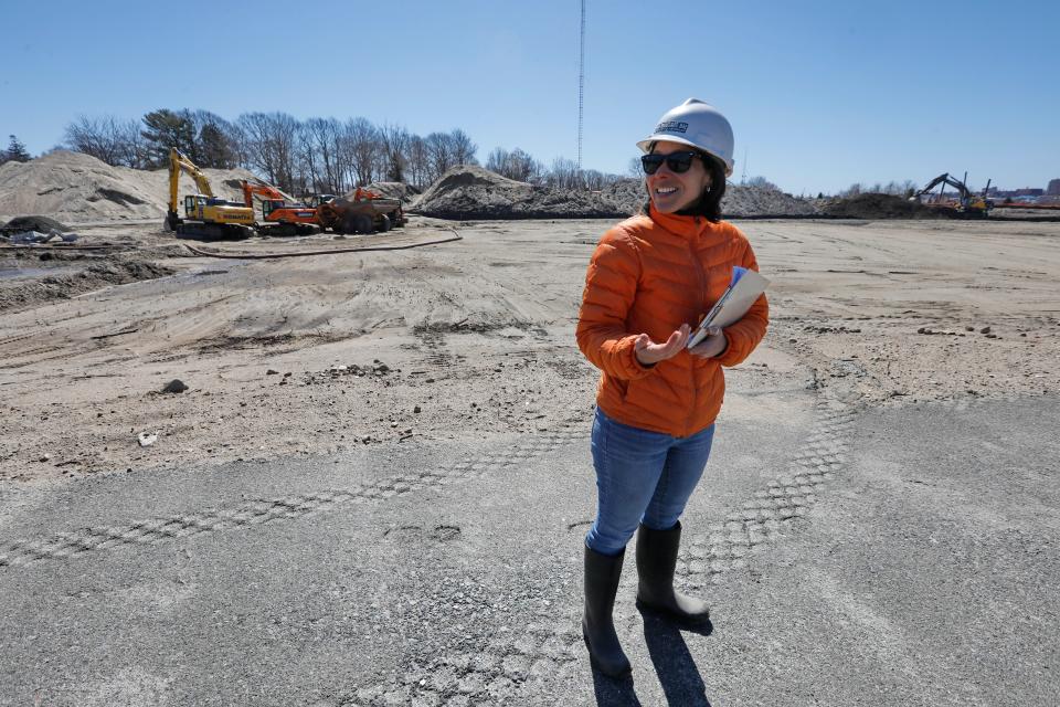 Sara N. da Silva Quintal, Restoration Ecologist, walks atop the walkway which will wind along the edges of the Marsh Island restoration project currently underway by the Buzzards Bay Coalition on the Fairhaven side of New Bedford's north harbor.