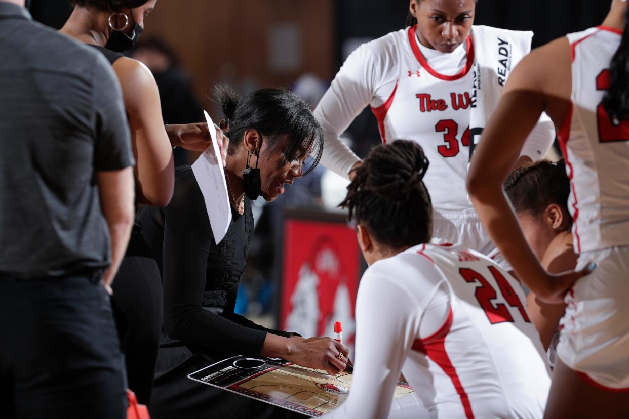 Gardner-Webb women's hoops coach Alex Simmons draws up a play during one of her team's games last season.