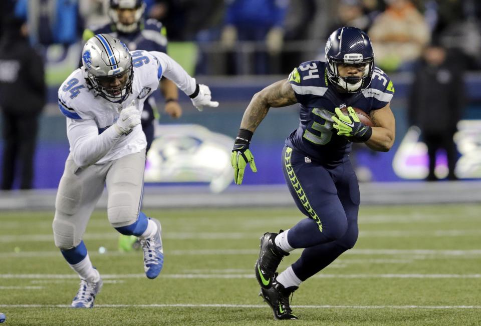 Thomas Rawls set a Seattle franchise record for rushing yards in a postseason game vs. Detroit. (AP)