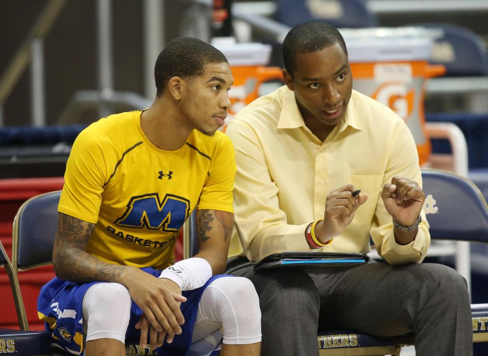 Nov 25, 2016; Pittsburgh, PA, USA; Morehead State Eagles guard Xavier Moon (22) talks with director of basketball operations Jonathan Mattox (R) before playing the Pittsburgh Panthers at the Petersen Events Center. Mandatory Credit: Charles LeClaire-USA TODAY Sports