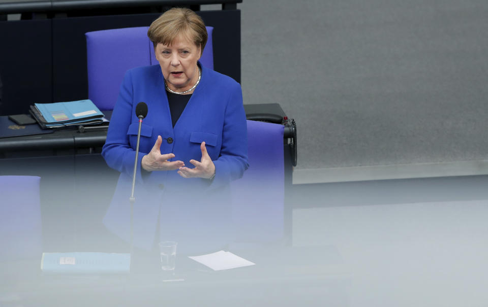 German Chancellor Angela Merkel takes questions as part of a meeting of the German federal parliament, Bundestag, at the Reichstag building in Berlin, Germany, Wednesday, May 13, 2020. (AP Photo/Michael Sohn)