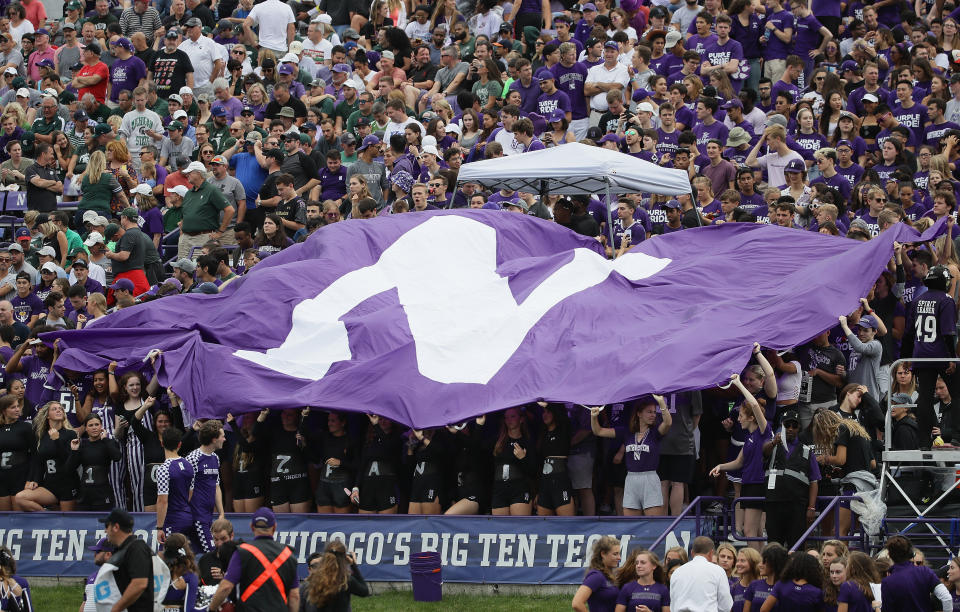 EVANSTON, ILLINOIS - SEPTEMBER 21: Student fans wave a Northwestern flag during a game between the Northwestern Wildcats
and the Michigan State Spartans at Ryan Field on September 21, 2019 in Evanston, Illinois. (Photo by Jonathan Daniel/Getty Images)