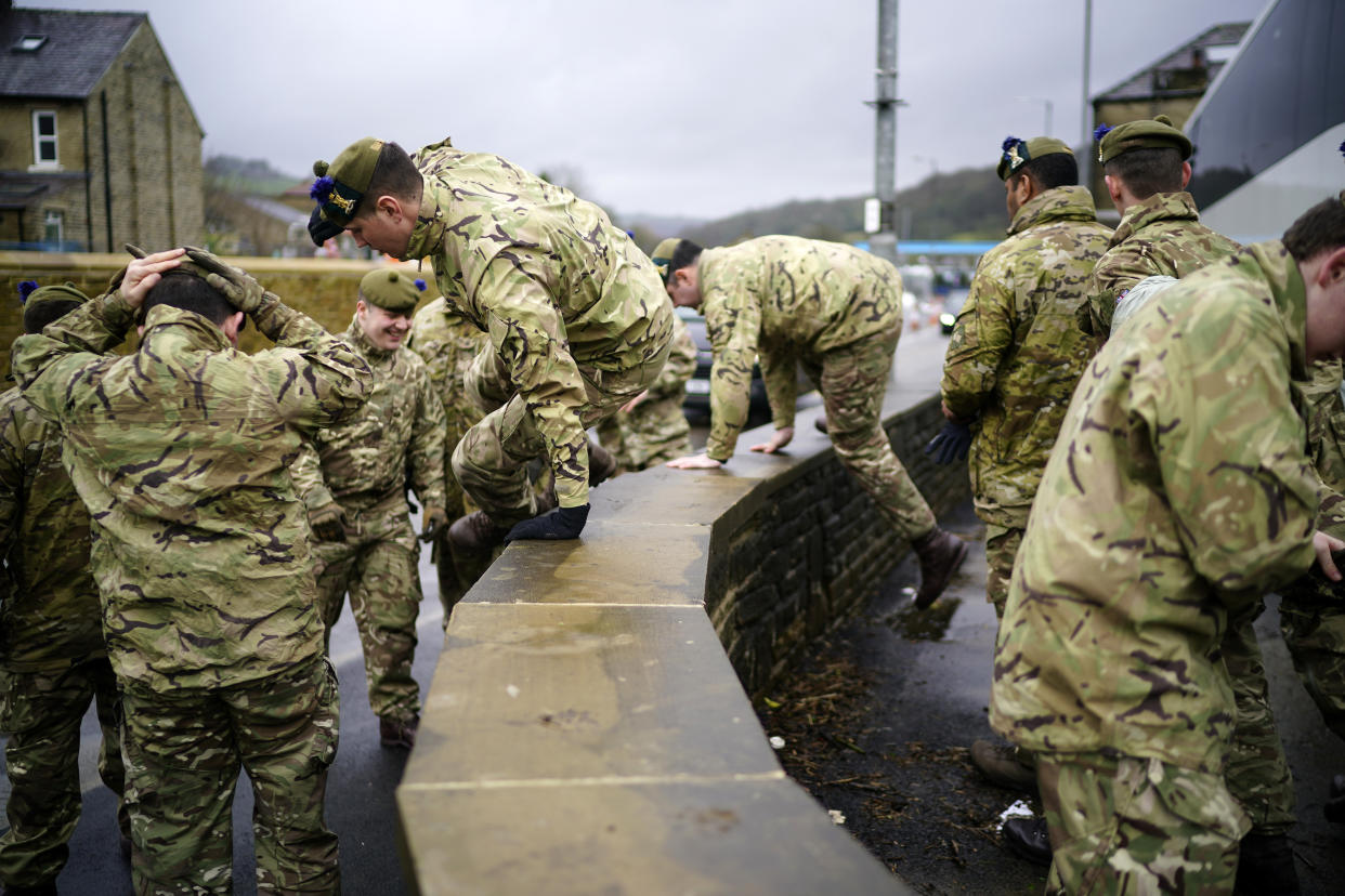 MYTHOLMROYD,  - FEBRUARY 15:  Soldiers from The Highlanders, 4th Battalion, The Royal Regiment of Scotland , help to shore up flood defences as Storm Dennis begins to make landfall in the UK on February 15, 2020 in Mytholmroyd, United Kingdom. In the wake of last week's Storm Ciara, people in the West Yorkshire Calder Valley are expecting to be flooded yet again. (Photo by Christopher Furlong/Getty Images)