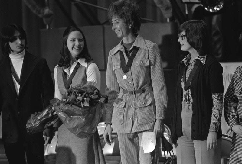 Forty years ago, Adams High School’s volleyball team allowed three boys to play under equal rights requirements of the federal Title IX law. From left to right, John Presnell, co-captain Luie Dragovich, Coach Sue Ganser and student manager Jill Oberfelt. Tribune File Photo