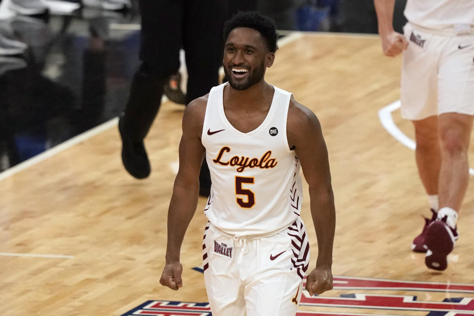 Loyola of Chicago's Keith Clemons (5) celebrates during the first half of the championship game against Drake in the NCAA Missouri Valley Conference men's basketball tournament Sunday, March 7, 2021, in St. Louis. (AP Photo/Jeff Roberson)