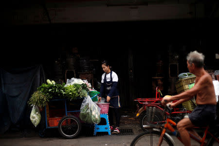 A street vendor sells vegetables in a street in Bangkok, Thailand, September 10, 2018. REUTERS/Soe Zeya Tun