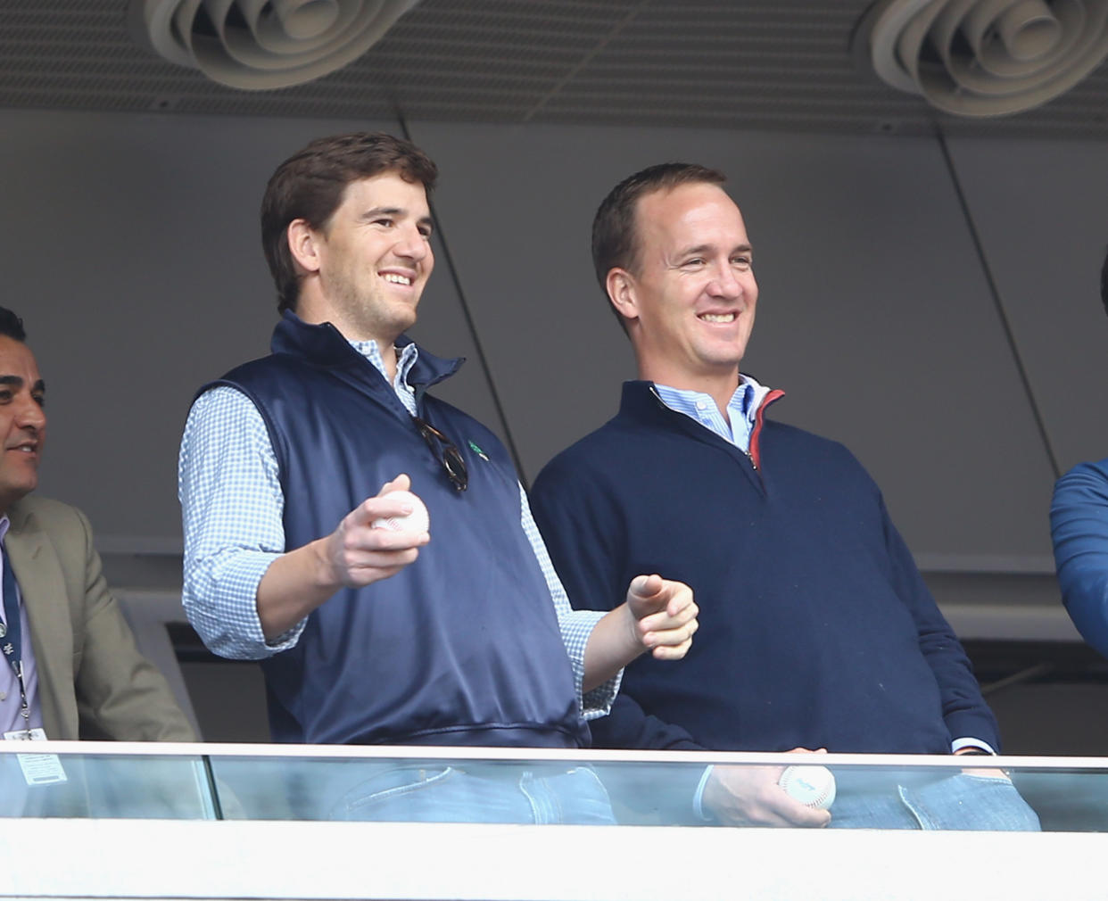 NEW YORK, NY - MAY 04:  Eli Manning of the New York Giants and Peyton Manning of the Denver Broncos appear at the game between the New York Yankees and the Tampa Bay Rays  on May 4, 2014 in the Bronx borough of New York City.  (Photo by Al Bello/Getty Images)