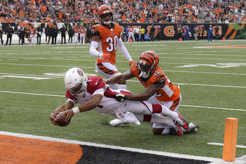 Arizona Cardinals quarterback Kyler Murray (1) leaps in for a touchdown against Cincinnati Bengals cornerback William Jackson (22) in the first half of an NFL football game, Sunday, Oct. 6, 2019, in Cincinnati. (AP Photo/Gary Landers)