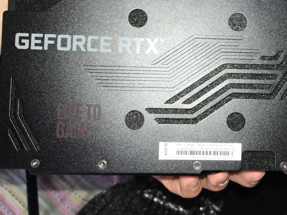 The fake graphic card, filled with a putty-like substance to provide weight, that Matthew says arrived from Amazon.  (Submitted by François Legault - image credit)