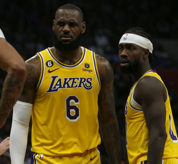 LOS ANGELES, CALIF. - NOV. 9, 2022. Lakers forward LeBron James, left, is upset.