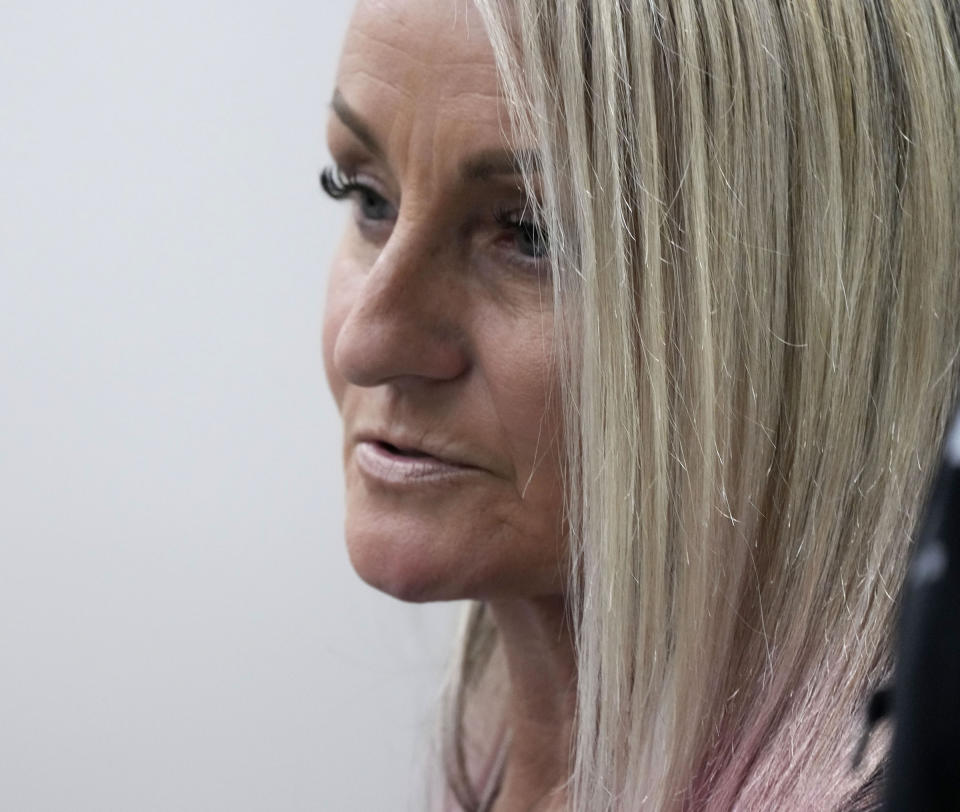 Sheri Sparks, mother of 8-year-old Jackson Sparks who was killed in the parade, reads a victim statement during Darrell Brooks' sentencing in a Waukesha County Circuit Court in Waukesha, Wis., on Tuesday, Nov. 15, 2022. Dozens of people are expected to speak at the sentencing proceedings for Brooks, who is convicted of killing six people and injuring dozens more when he drove his SUV through a Christmas parade in Waukesha last year. (Mike De Sisti/Milwaukee Journal-Sentinel via AP, Pool)
