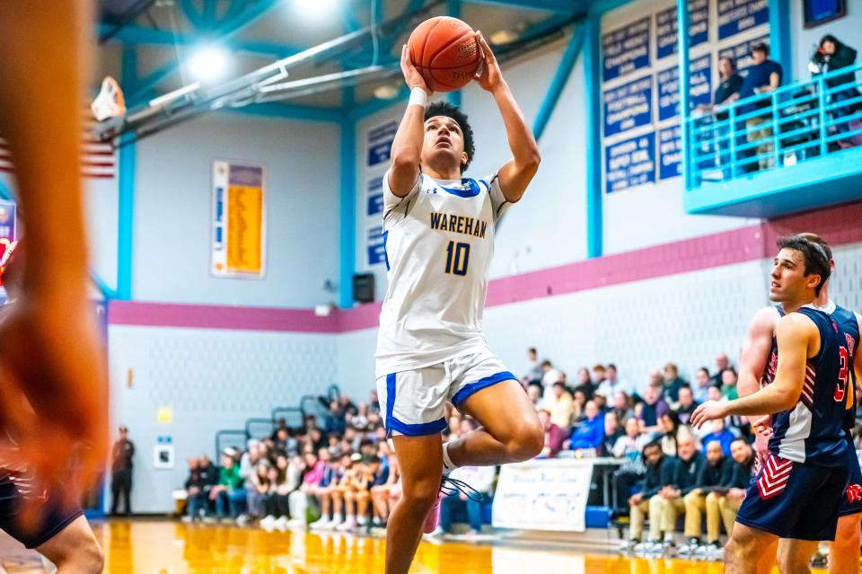 Wareham's Ajay Lopes drives to the basket..