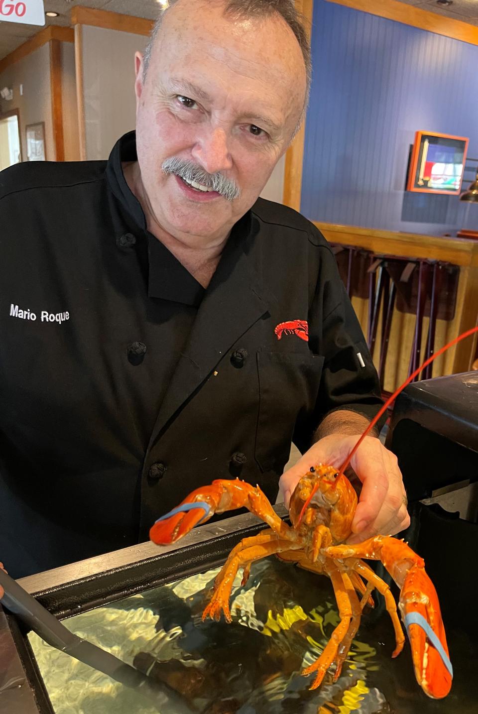 Red Lobster manager Mario Roque helped arrange Cheddar's rescue after noticing her brightly-colored orange shell. (Photo: Red Lobster)