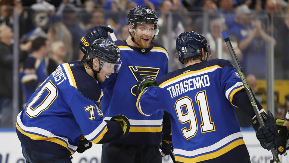 St. Louis Blues center Oskar Sundqvist (70), of Sweden; defenseman Colton Parayko (55); and Vladimir Tarasenko (91), of Russia, celebrate after the Blues scored a goal against the San Jose Sharks during the third period in Game 6 of the NHL hockey Stanley Cup Western Conference final series Tuesday, May 21, 2019, in St. Louis. The Blues won 5-1 to win the series 4-2. (AP Photo/Jeff Roberson)