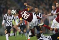 AS Roma's Seydou Keita heads the ball to score against Juventus during their Italian Serie A soccer match at the Olympic stadium in Rome March 2, 2015. REUTERS/Giampiero Sposito