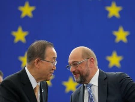 U.N. Secretary General Ban Ki-moon (L) shakes hands with European Parliament President Martin Schulz after the European Parliament vote in favor of the Paris U.N. COP 21 Climate Change agreement during a voting session at the European Parliament in Strasbourg, France, October 4, 2016. REUTERS/Vincent Kessler