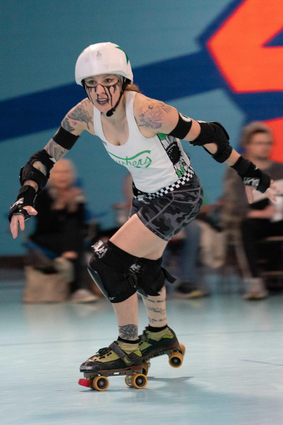 Capital City Crushers Charissa Totten, or Goose Ya, breaks free as a jammer during Saturday's bout against the Salina Sirens.