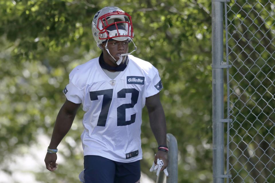 New England Patriots running back J.J. Taylor walks to the field for an NFL football training camp practice, Friday, Aug. 21, 2020, in Foxborough, Mass. (AP Photo/Michael Dwyer, Pool)