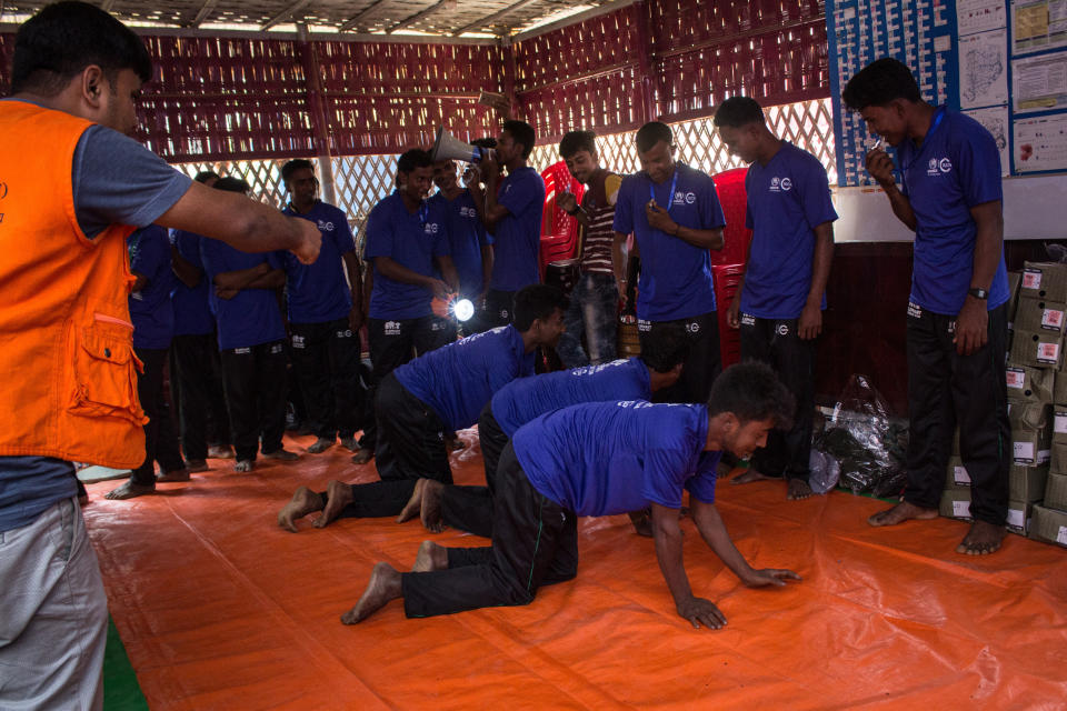 Volunteers&nbsp;take part in a patrolling drill during&nbsp;elephant response&nbsp;training at Kutupalong refugee camp in March. (Photo: Kazi Riasat Alve for HuffPost)