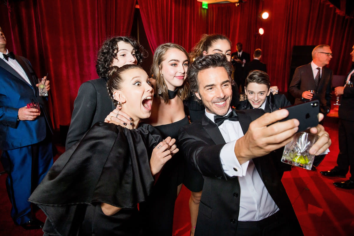 BEVERLY HILLS, CA - JANUARY 07: In this handout photo provided by Netflix, Millie Bobby Brown, Finn Wolfhard, Shawn Levy and Noah Schnapp attend the Netflix Golden Globes after party at Waldorf Astoria Beverly Hills on January 7, 2018 in Beverly Hills, California. (Photo by Netflix via Getty Images)<p>Handout/Getty Images</p>