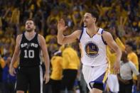 May 14, 2017; Oakland, CA, USA; Golden State Warriors guard Klay Thompson (11) celebrates in front of San Antonio Spurs forward David Lee (10) during the third quarter in game one of the Western conference finals of the 2017 NBA Playoffs at Oracle Arena. The Warriors defeated the Spurs 113-111. Mandatory Credit: Kyle Terada-USA TODAY Sports