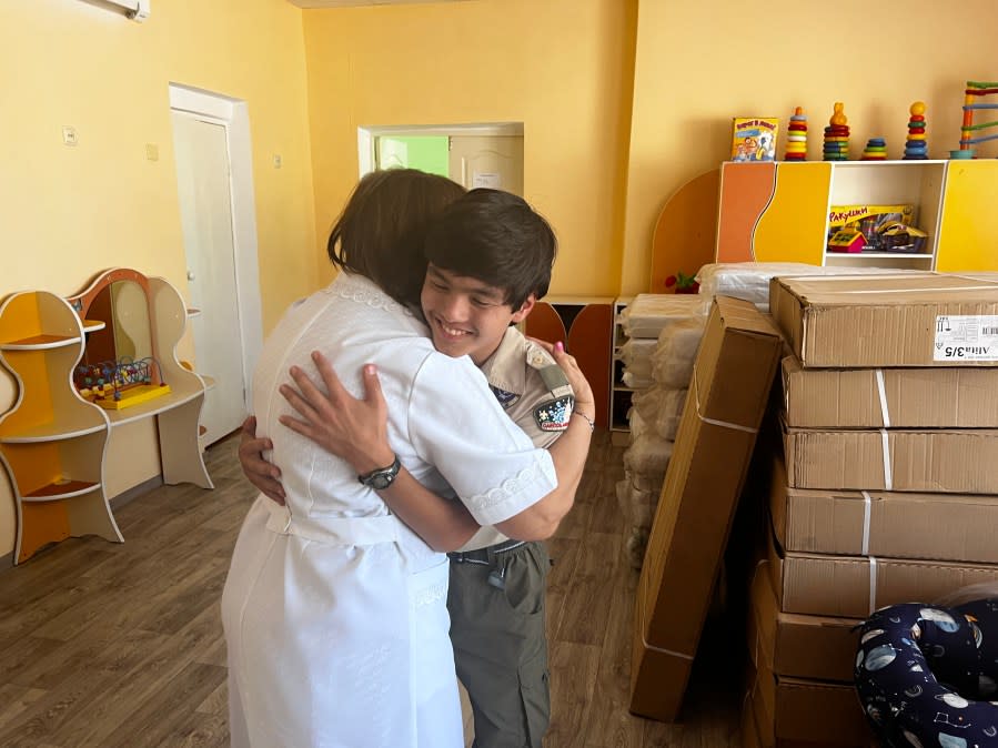 Griffin, right, hugging the director of the baby house he was from in Petropavl (Photo Courtesy: Susan Moore).