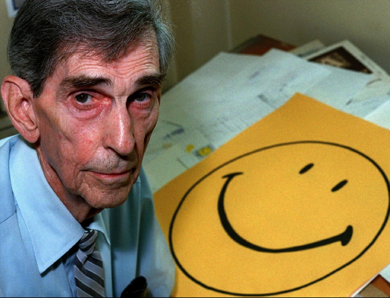 Harvey Ball, with iconic smiley face, shown in 1998.