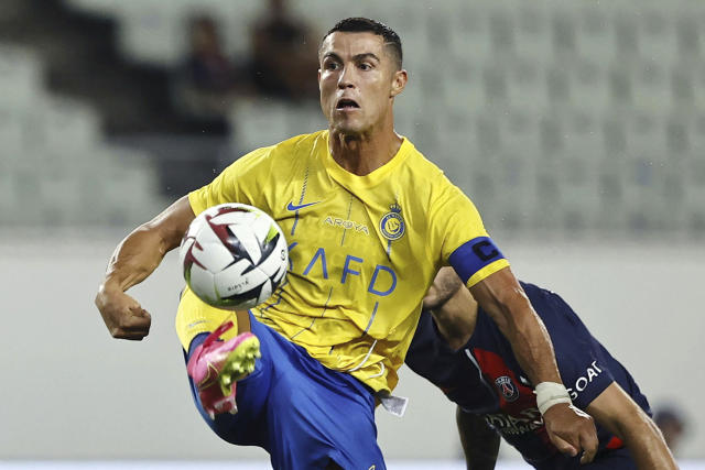 Brazil's forward Neymar controls the ball wih his chest during a