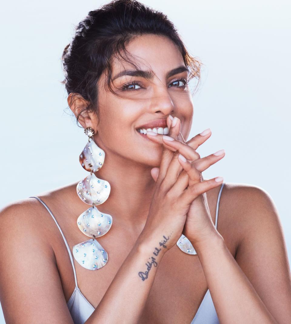 Heavy is the head that wears the crown—or, in this case, a pair of crystal and mother-of-pearl encrusted shoulder-dusting Gucci earrings. For Chopra, though, the weight that comes with a high-profile life in Hollywood is just the start of it.