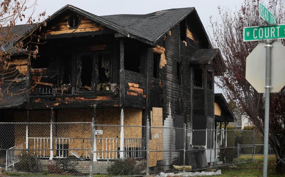 Lillian and Ernesto Parra’s heavily fire damaged home on the corner of Road 103 and West Court Street is still boarded up and surrounded by a fence.