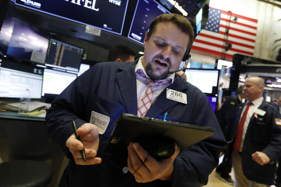 Trader Michael Milano works on the floor of the New York Stock Exchange, Tuesday, Nov. 12, 2019. Stocks are opening slightly higher on Wall Street, led by gains in technology and health care companies. (AP Photo/Richard Drew)