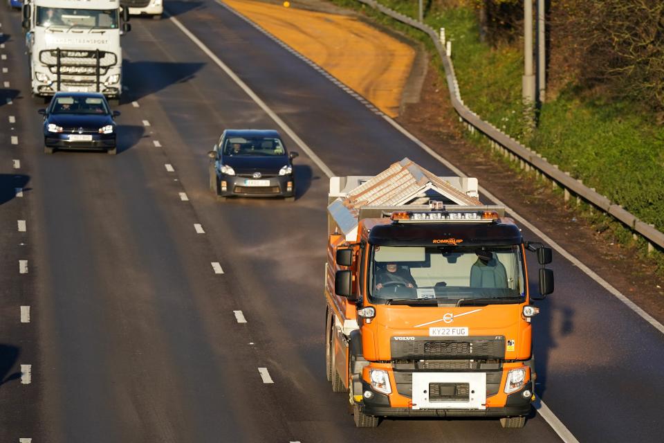 A gritter spreads salt along the M42 close to Birmingham today (PA)