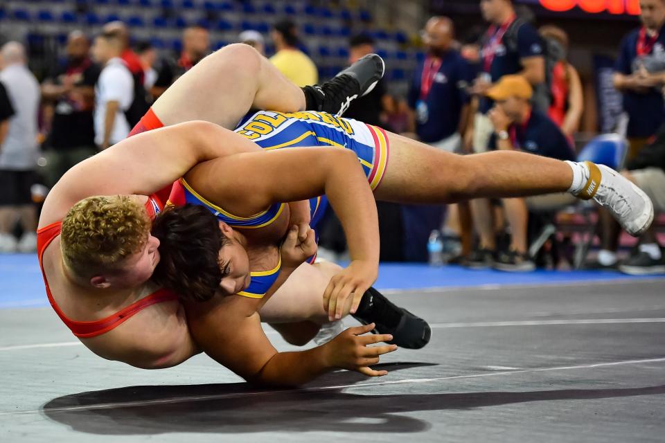 Wadsworth's Aaron Ries (left) gut wrench's Colorado's T.J. Rivera during opening round action at the 16U National Freestyle Championships in Fargo, N.D.