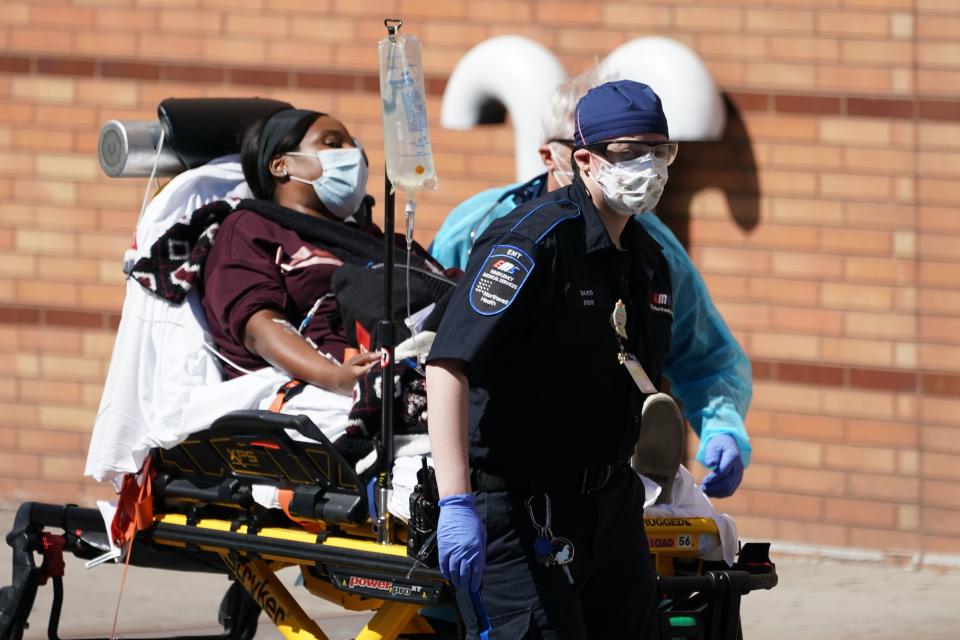 Emergency Medical Technicians bring a patient into Wyckoff Hospital in the Borough of Brooklyn on April 6, 2020 in New York. - New York Governor Andrew Cuomo on Monday extended a shutdown in the epicenter of America's deadly coronavirus pandemic until near the end of the month. Cuomo said the COVID-19 death rate in New York was "effectively flat" for the past two days but announced that schools and non-essential businesses must stay shut until April 29. (Photo by Bryan R. Smith / AFP) (Photo by BRYAN R. SMITH/AFP via Getty Images)