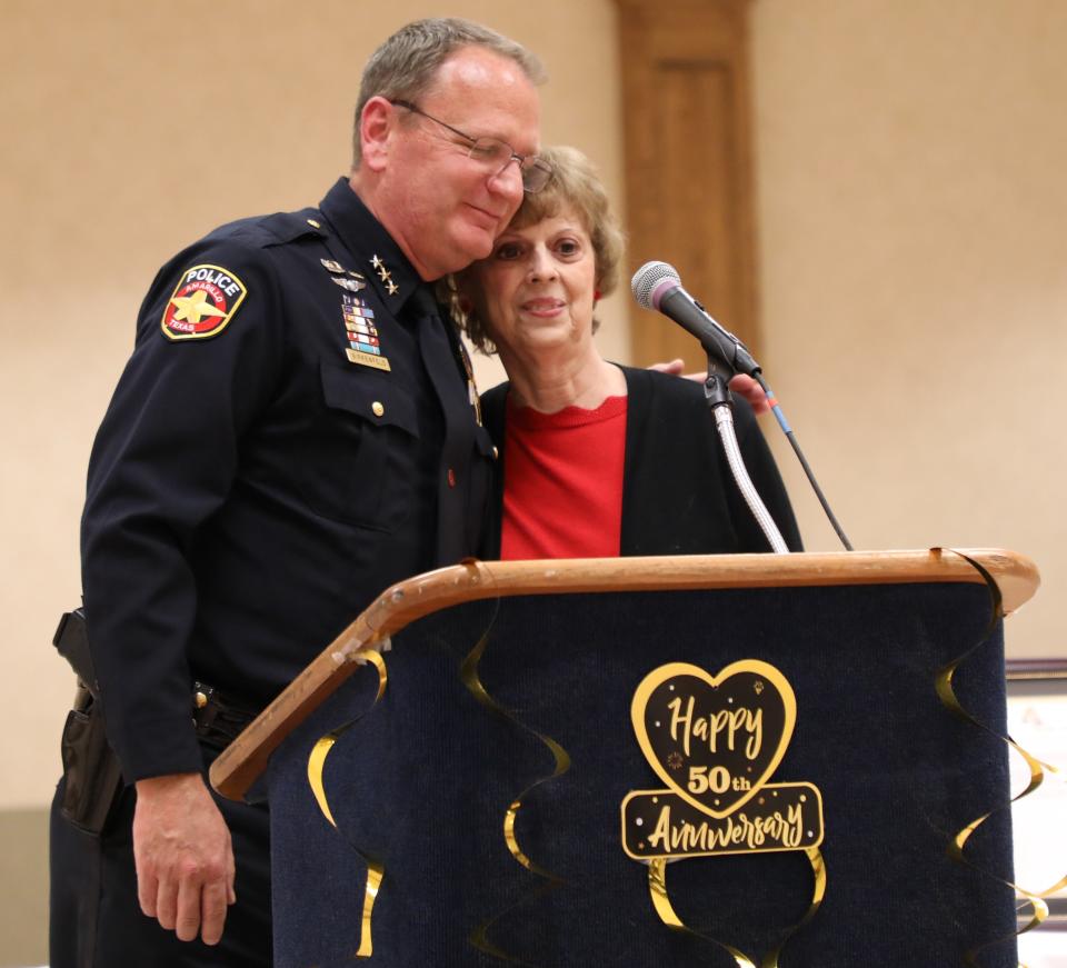 Chief Martin Birkenfeld of the Amarillo Police Department, left congratulates Rosemary Robinson during a recent 50th anniversary celebration of her employment with the City of Amarillo.