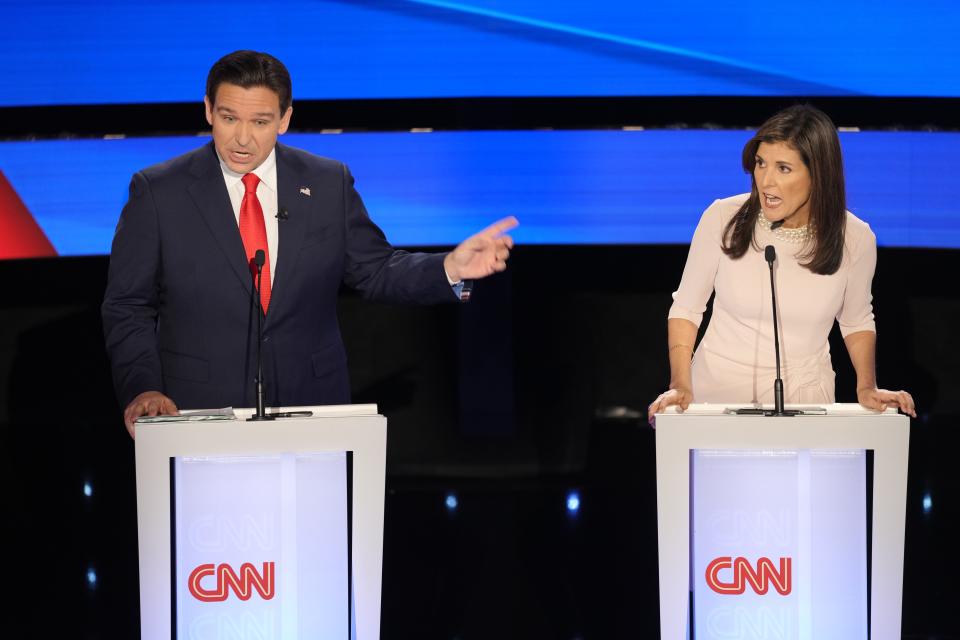 Florida Gov. Ron DeSantis and former South Carolina Gov. Nikki Haley exchange words as they take part in a Republican Presidential Primary Debate at Drake University in Des Moines, Iowa hosted by CNN, Wednesday, Jan. 10, 2024.