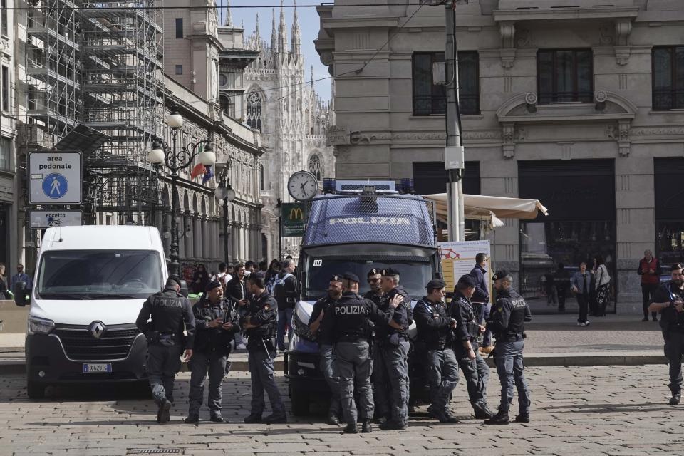 Police patrol near by the Milan gothic cathedral in Milan, Monday, March 25, 2024. Italy followed France Monday in stepping up its security stance following the attack on a suburban Moscow concert hall and the claim of responsibility by an affiliate of the Islamic State group. (AP Photo/Luca Bruno)
