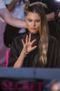 Behati Prinsloo appears backstage during hair and makeup at the 2018 Victoria's Secret Fashion Show at Pier 94 on Thursday, Nov. 8, 2018, in New York. (Photo by Charles Sykes/Invision/AP)