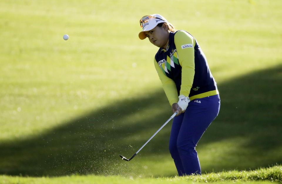 Inbee Park, of South Korea, chips to the green on the 11th hole during the first round at the LPGA Kraft Nabisco Championship golf tournament Thursday, April 3, 2014 in Rancho Mirage, Calif. (AP Photo/Chris Carlson)