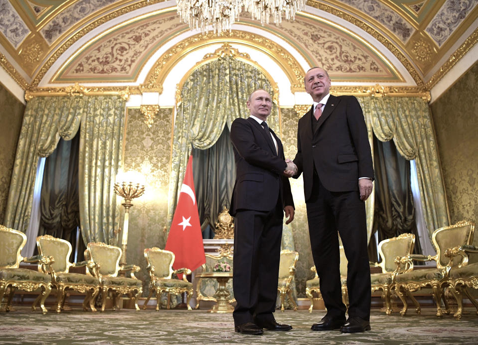 FILE - In this April 8, 2019, file photo, Russian President Vladimir Putin, left, and Turkish President Recep Tayyip Erdogan shake hands during their meeting in the Kremlin in Moscow, Russia. The violence raging once again in the northwestern province of Idlib, Syria's last rebel-held bastion, is putting Turkish-Russian relations to the test. (Alexei Nikolsky, Sputnik, Kremlin Pool Photo via AP, File)