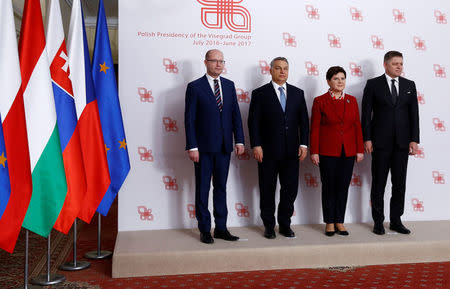 Visegrad Group (V4) member nations' Prime Ministers, Bohuslav Sobotka of the Czech Republic, Hungary's Viktor Orban, Poland's Beata Szydlo and Slovakia's Robert Fico pose for a family photo during a summit in Warsaw, Poland March 2, 2017. REUTERS/Kacper Pempel