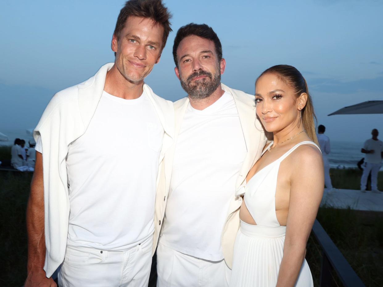 Tom Brady, Ben Affleck, and Jennifer Lopez pose for a photo at Michael Rubin's 2023 white party.
