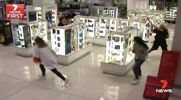 Shoppers flee as he starts smashing perfume counters with the bat. Source: 7 News