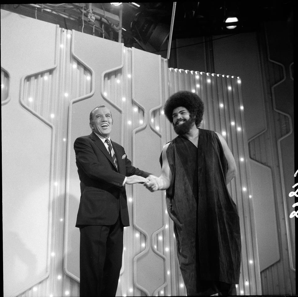 American boxer and sometime actor Muhammad Ali shakes hands with American television empresario Ed Sullivan (1902 - 1974) on an episode of Sullivan's 'Toast of the Town,' New York, January 18, 1970. Ali has just performed an excerpt from 'Buck White' a Broadway musical in which he starred.(Photo by CBS Photo Archive/Getty Images)