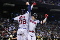 Boston Red Sox's Enrique Hernandez, right, celebrates his two-run home run against the Arizona Diamondbacks with Triston Casas (36) during the fourth inning of a baseball game Friday, May 26, 2023, in Phoenix. (AP Photo/Ross D. Franklin)