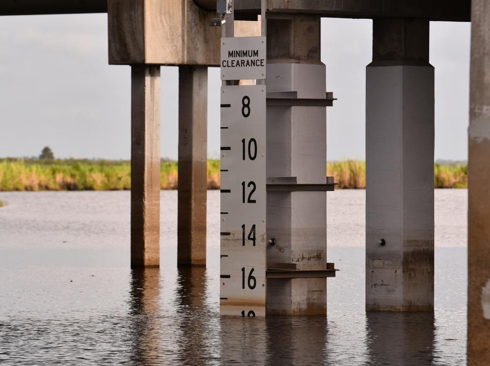 The water level markers on the State Road 520 bridge this week over the St. Johns River at Lone Cabbage Fish Camp.