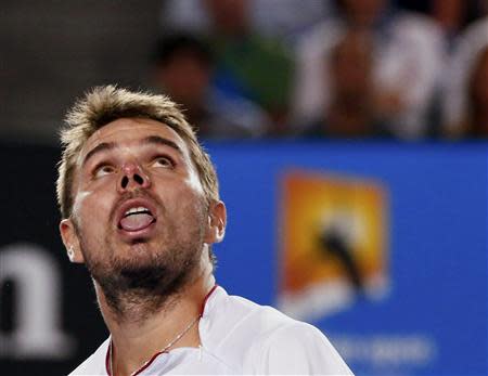 Stanislas Wawrinka of Switzerland watches a high ball during his men's singles semi-final match against Tomas Berdych of the Czech Republic at the Australian Open 2014 tennis tournament in Melbourne January 23, 2014. REUTERS/Petar Kujundzic